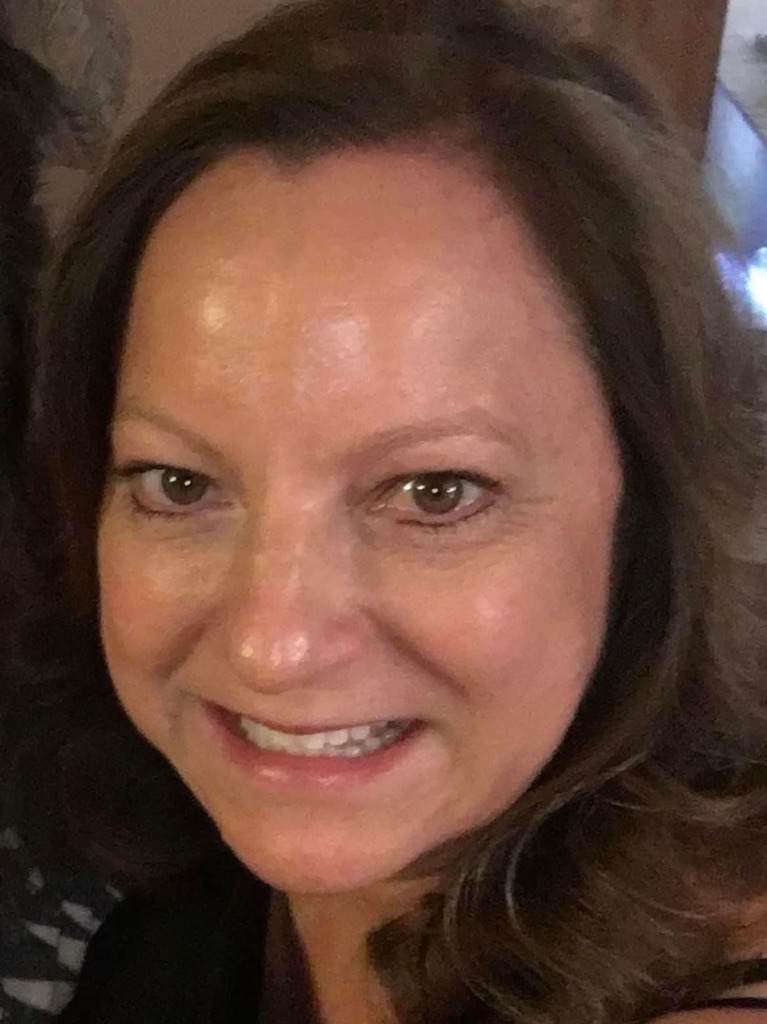Professional headshot of Brenda Gordon, APRN, FNP-C, smiling at camera